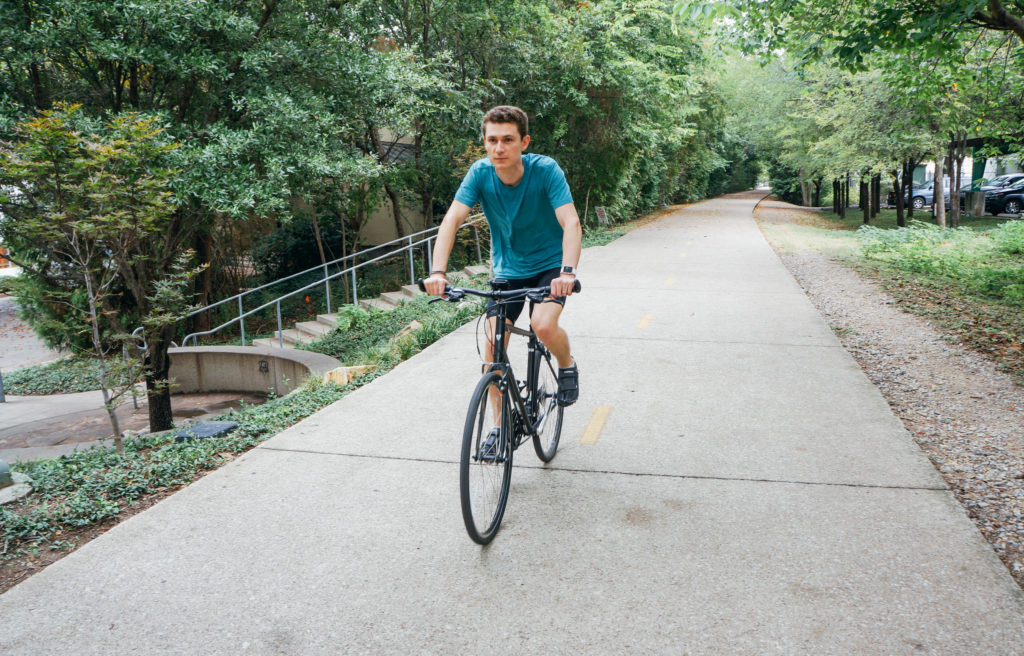 Man riding bicycle on trail