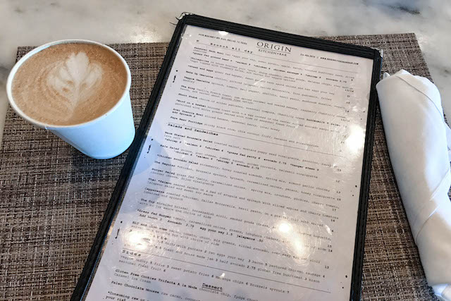 latte and menu on a table